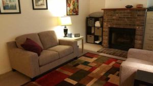 psychotherapist office with couch fireplace